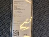 the luggage tag is attached to the seat of a plane