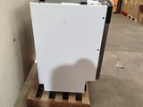 an image of a refrigerator in a warehouse with pallets
