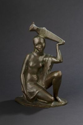 bronze statue of a seated woman holding a bottle and a bottle of wine