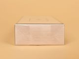 an image of a white box with a clear lid on a yellow background
