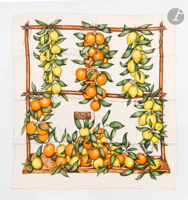 an image of a kitchen towel with oranges and leaves on it