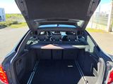the back of a car with the trunk open on the street
