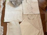 many pieces of cloth laid out on the floor next to each other