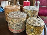three decorative boxes are sitting on a table in a living room