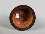 an image of a wooden bowl sitting on top of a table