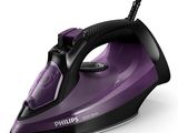 un objet en fer violet et noir posé sur une surface blanche
