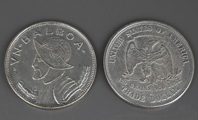 une image représentant deux pièces d'argent, l'une à l'effigie d'une femme et l'autre à celle d'un homme
