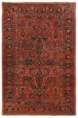 an antique persian rug with red and blue colors