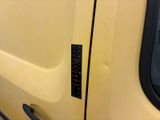 a close up of a car door handle with a sticker on it