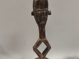 a statue of a man with a hat on a table