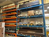 many shelves with different types of metal items in a warehouse