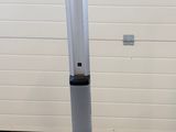 a black and white pole with a yellow banana on it