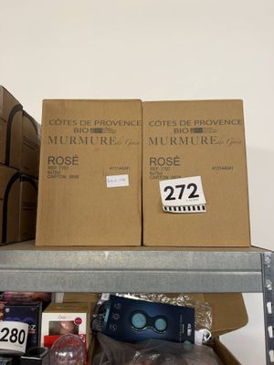 many boxes on a shelf in a room with a lot of stuff