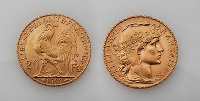two gold sovereigns, one of which has a head of a woman and one of which has a head