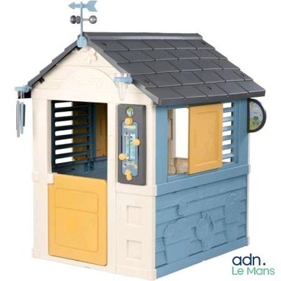 a little house with a weather vane on top of it