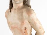 a statue of a man with a knife in his hand