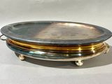 a silver tray with three different colored plates on it