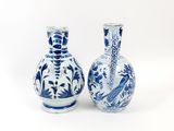 pair of blue and white vases on a white background