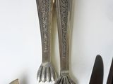 a lot of silver spoons and forks on the table