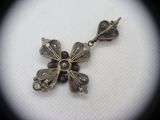 an image of a close up of a necklace on a white surface