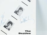 an image of a book with autographs of the beatles on it