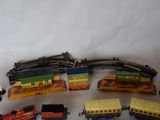 several toy trains are lined up on a white surface