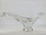 a clear glass vase with a curved design on it