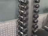 a rack of dumbbells in a gym room