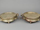 pair of silver plated bowls with handles