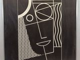 a black and white drawing of a man ' s face on a black background