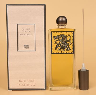 an image of a bottle of perfume sitting next to a box