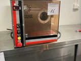 a microwave sitting on a counter in a kitchen