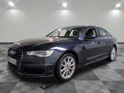 the audi s8 sedan is parked in a large room