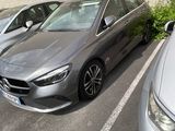 three cars parked in a parking lot next to each other