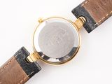 an image of a close up of a wrist watch on a white surface