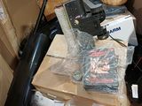 a pile of boxes and other items on the floor