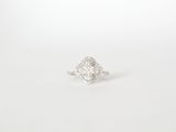 a close up of a diamond ring on a white background