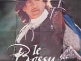 affiche française du film « Le Boss », mettant en scène un jeune homme armé d'une épée