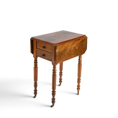 a small wooden table with a drawer on it