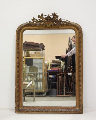 a mirror that is sitting on the floor in a room
