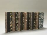 a stack of books sitting on top of each other on a table