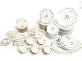 a lot of plates and bowls on the table