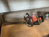 a picture of a chainsaw and other tools sitting on a table