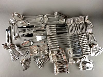 a lot of silver spoons and forks on the table