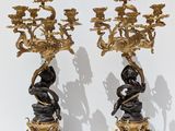 pair of antique bronze candlesticks with cherenshes and cherenshes on them