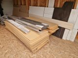 several pieces of wood are stacked on top of each other in a room