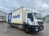 a picture of a delivery truck parked in a parking lot