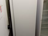 two refrigerators that are next to each other in the kitchen