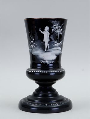 black and white picture of a vase with a child on it