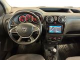 the interior of a small car with a steering wheel and dashboard controls